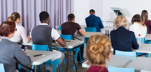 Rear view of people in auditorium