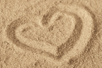 heart shape on sand background texture