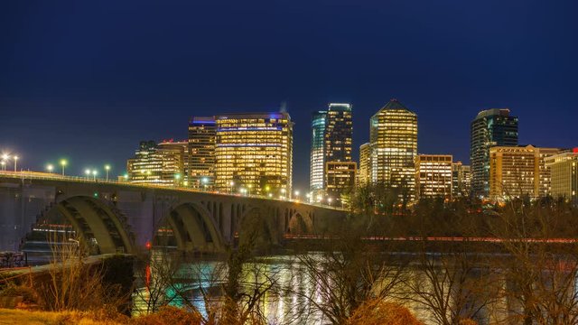 View on Key bridge and Rosslyn skyscrapers at dusk: timelapse of dat to night transition, Washington DC, USA