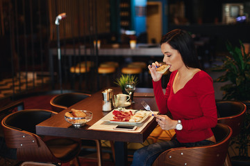 Young woman breakfast in a restaurant