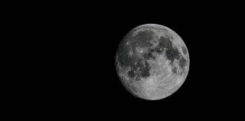 Obraz na płótnie Canvas View of full moon against dark black sky