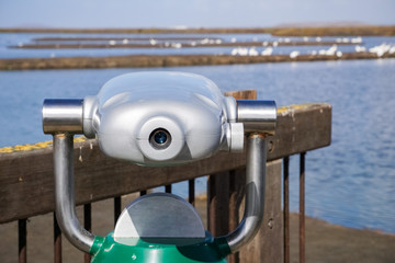 Outdoor daytime viewing telescope looking over the bay area, Alviso Marsh, south San Francisco bay...