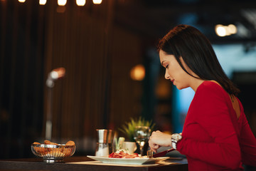 Young woman breakfast in a restaurant