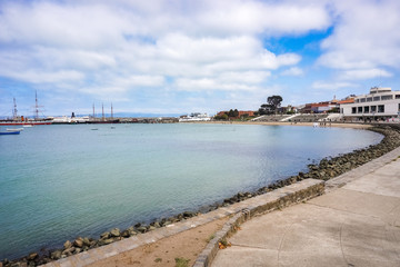 Obraz premium Looking out across the bay towards the docked museum ships and Maritime Museum