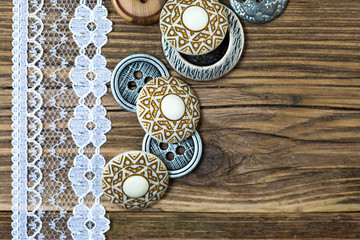 several vintage buttons and lace tape