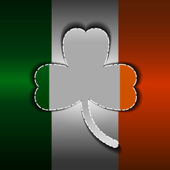 St. Patrick's Day, a clover carved from metal. Flag of Ireland.