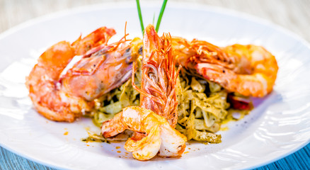 Fine dining organic food pasta with prawns and mussel seafood