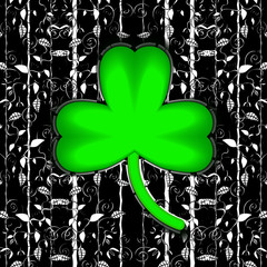 Holiday. St.Patrick's Day. Celebration. Monochrome leaves and green clover. Ireland Clover trefoil. Ink illustration.