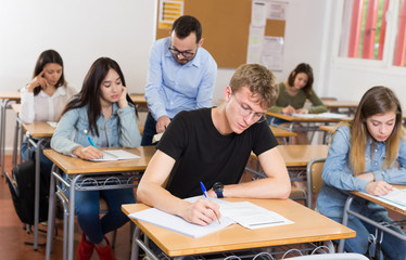 Student is sitting test and answer about task