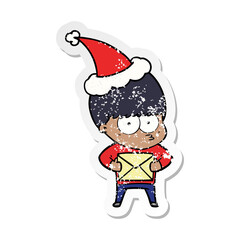 nervous distressed sticker cartoon of a boy wearing santa hat