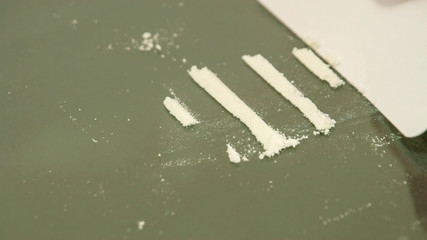 3303_White_powder_being_lined_on_the_table.jpg