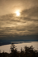 Sunset over a frozen Mooselookmeguntic Lake in Rangeley, Maine.
