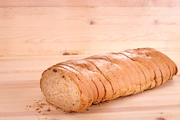 Bread lying on a wooden table, close-up