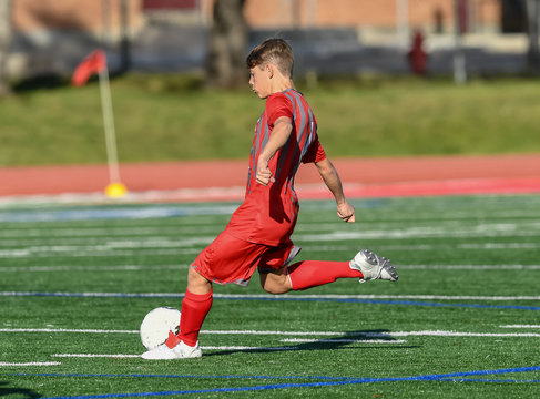 High School boy athlete making amazing plays during a soccer game