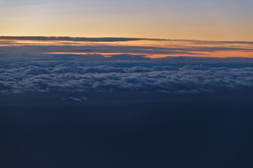 Fototapeta na wymiar Beautiful Cloudscape Scene at Sunset from Airplane