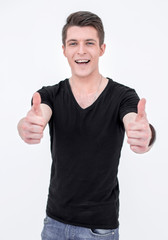 Fototapeta premium Young man in black t shirt shows thumb up.