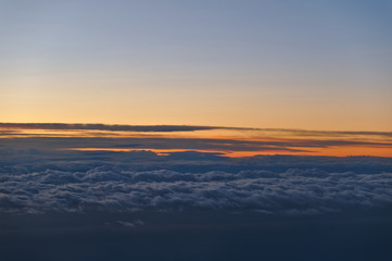 Fototapeta premium Beautiful Cloudscape Scene at Sunset from Airplane