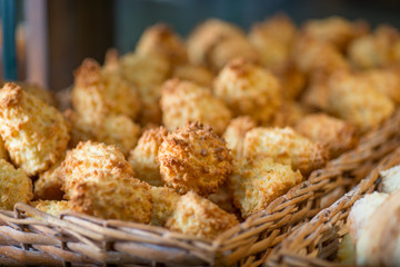biscuits and pastries in the basket on the display of the bakery