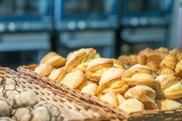 bakery products on display against the background of ovens in the bakery