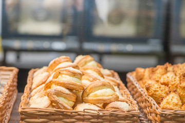 bakery products on display against the background of ovens in the bakery