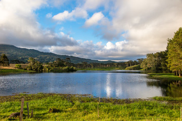 Perimbo dam lake, with many trees and lawn in the surroundings, Petrolandia, Santa Catarina, Brazil
