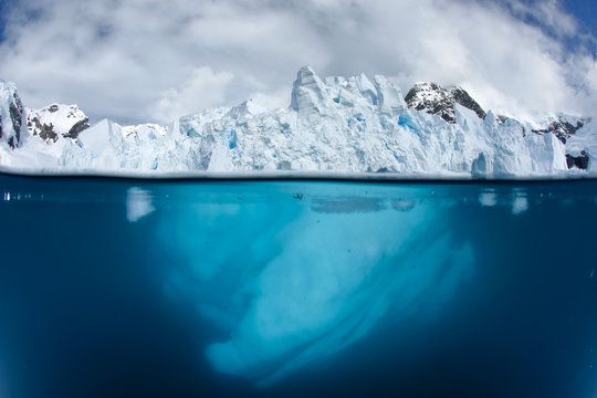 Split view with glacier front above and underwater 