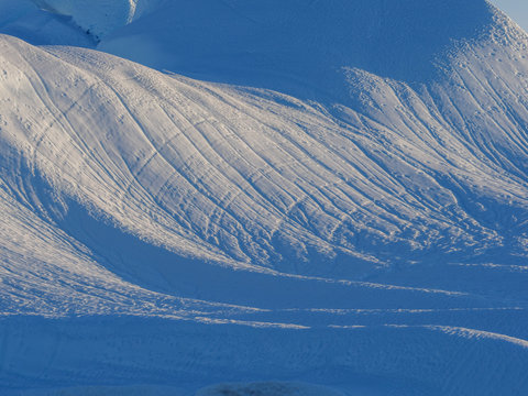 Patterns on snowy hills