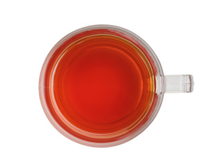 transparent cup with black tea the top view on a white background