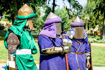 Men in Medieval Warriors' Clothes before the Fight_