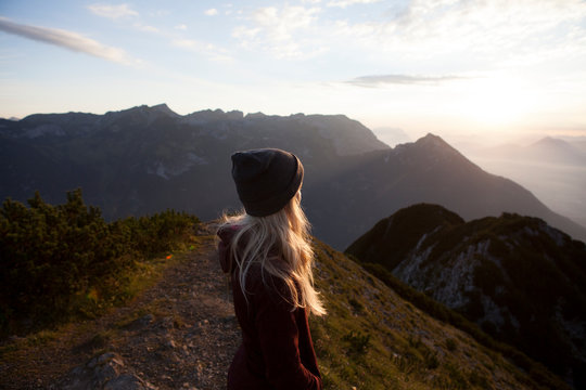 Austria, Tyrol, hiker enjoying the view on Achensee at sunrise