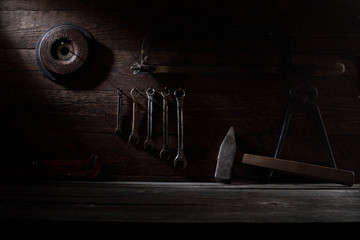 Different workpieces on a wooden background. Hedge wrenches keys, hammer