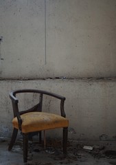 Fototapeta na wymiar Chair in an abandoned room