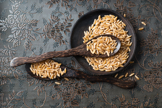 Bowl and wooden spoons with kamut