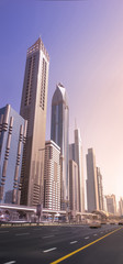 Fototapeta na wymiar Morning Speedway in downtown. Skyscrapers of Dubai at sunrice. Business Bay District, UAE, Jun.2018