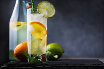 Refreshing lemon and lime tonic on a table with copy space