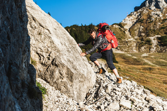 Couple mountain hiking in rocky terrain