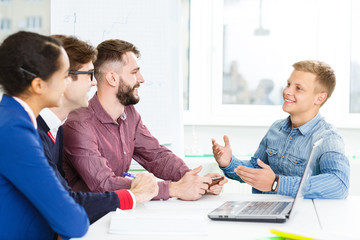 Creative team having a brainstorming session in the boardroom