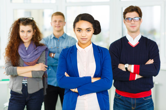 Creative business team posing together at the office