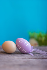 Easter composition with Easter eggs on the blue and red background.