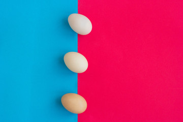 Easter composition with Easter eggs on the blue and red background.