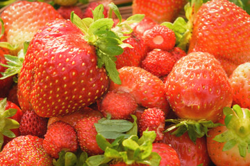 Delicious dessert red strawberry. Ripe, juicy and red, strawberries in a plate close-up, in full frame.
