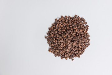 a pile of coffee beans on a white background