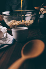 Cropped image of woman at table cooking pie