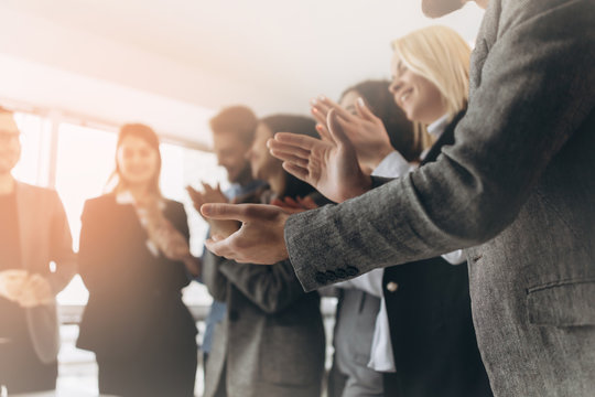 Multiracial group of business people clapping hands to congratulate their boss - Business company team, standing ovation after a successful meeting