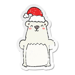 distressed sticker of a cartoon bear wearing christmas hat