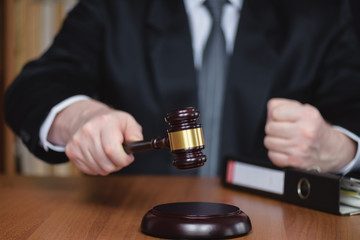 Justice and law concept. Wooden hammer of the judge. Court and decision. Judge hammer on the wooden table.