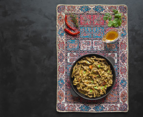 Asian beef thin slices in curry sauce. Top view.