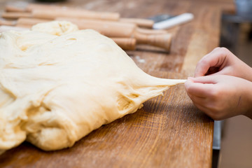 Small children take the dough. Hands close up