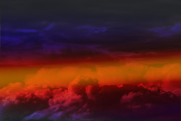 Multicolored clouds in front of a thunderstorm against the beautiful sky.