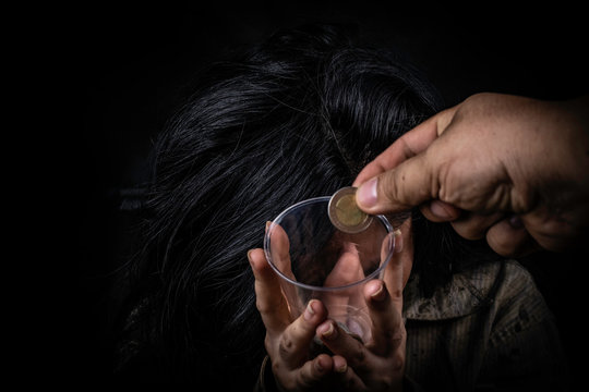 Dirty beggar asking for some money homeless concept on black background